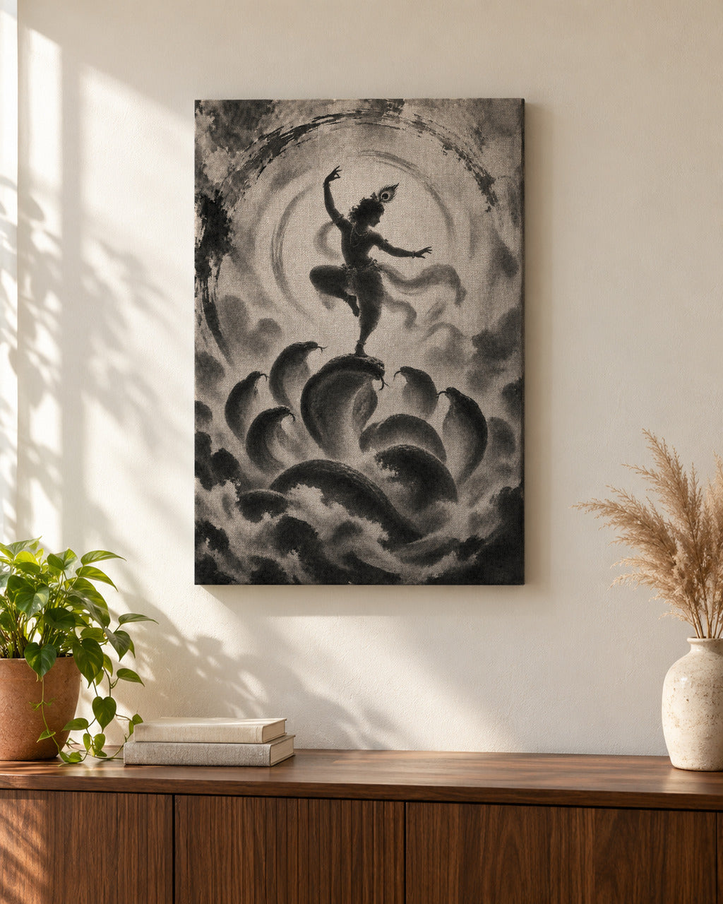 Kaliya Mardan Krishna canvas above a walnut console in a sunlit living room