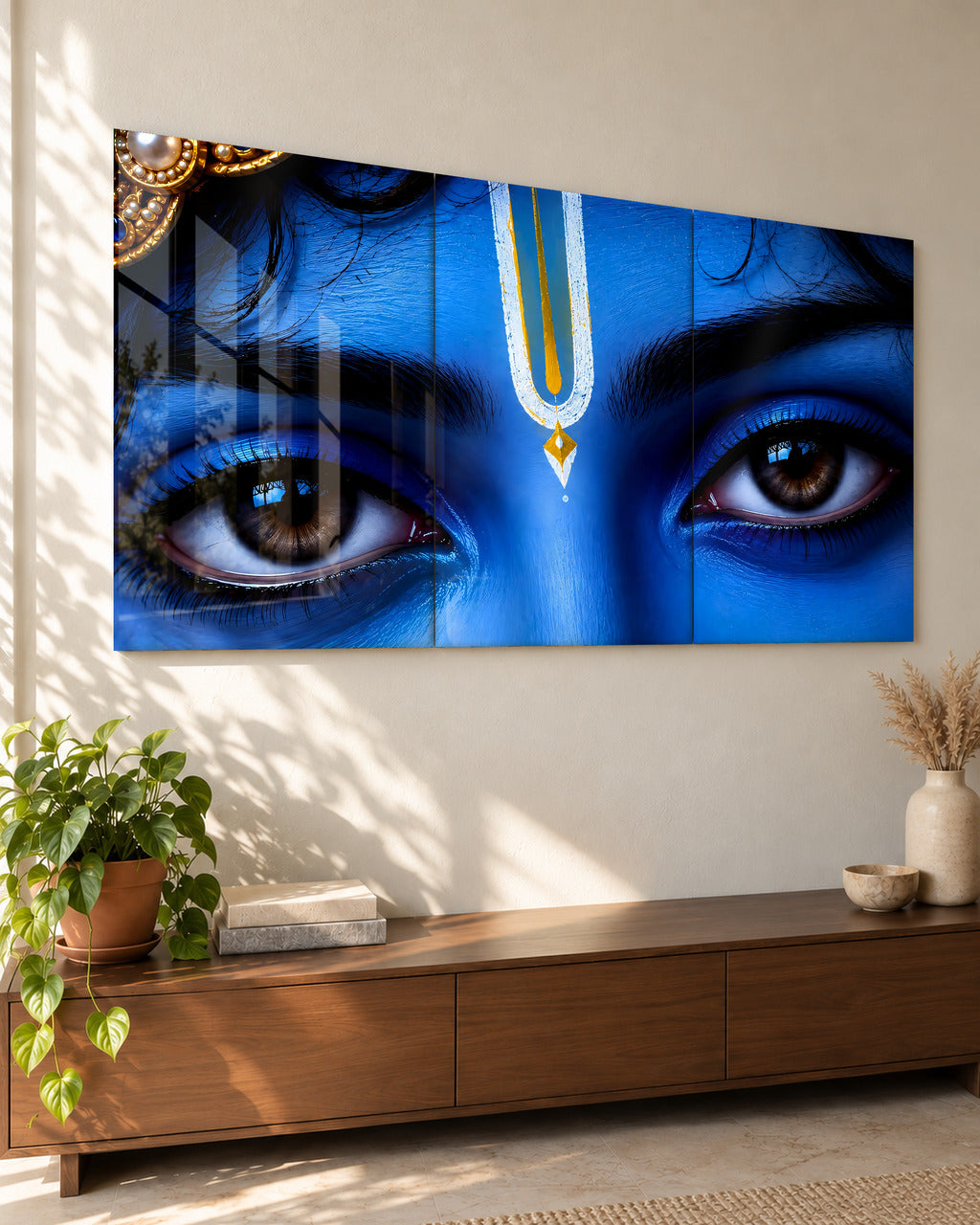 Krishna Gaze set of 3 acrylic wall art, seen from the side in a living room
