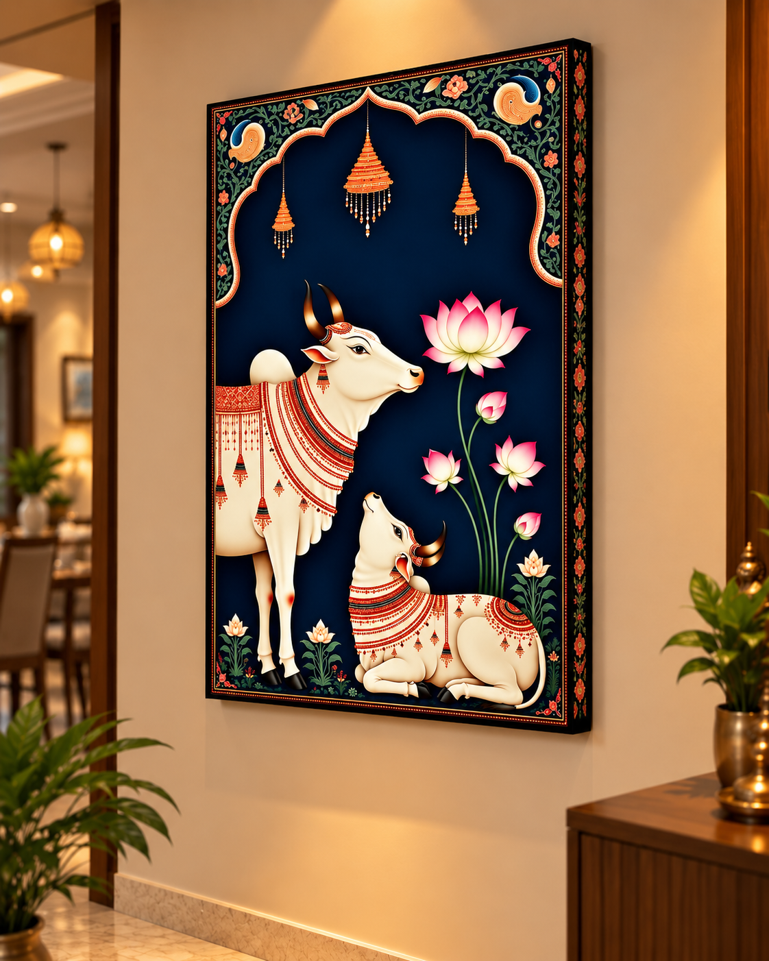 Pichwai Cow and Calf canvas above a wooden console in a lit hallway